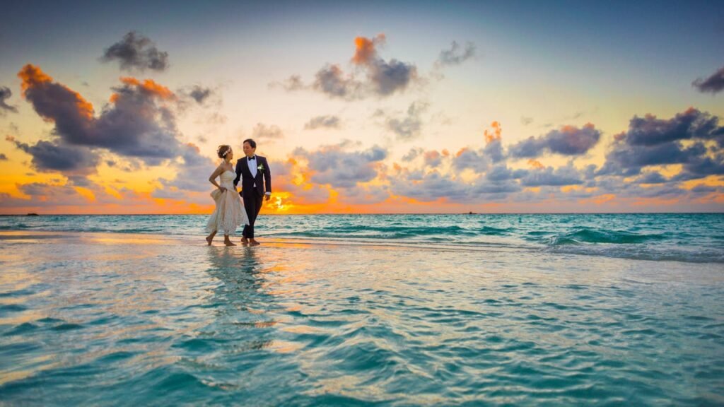 A newly wedded couple at the beach