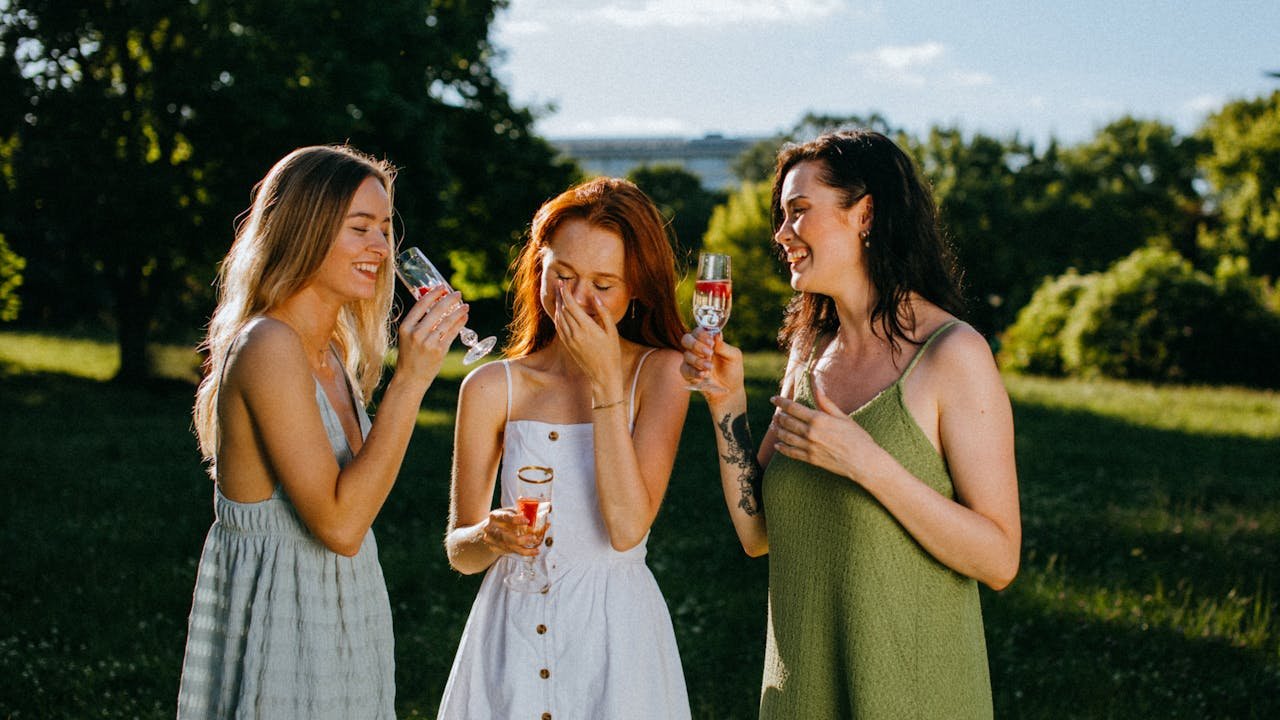 Girls enjoying and laughing in a wine tasting event