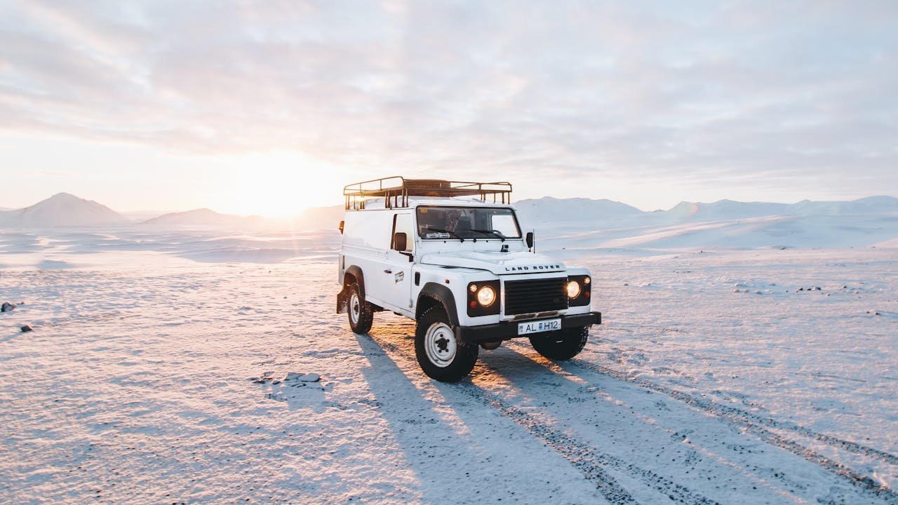 A white vehicle on a camping site