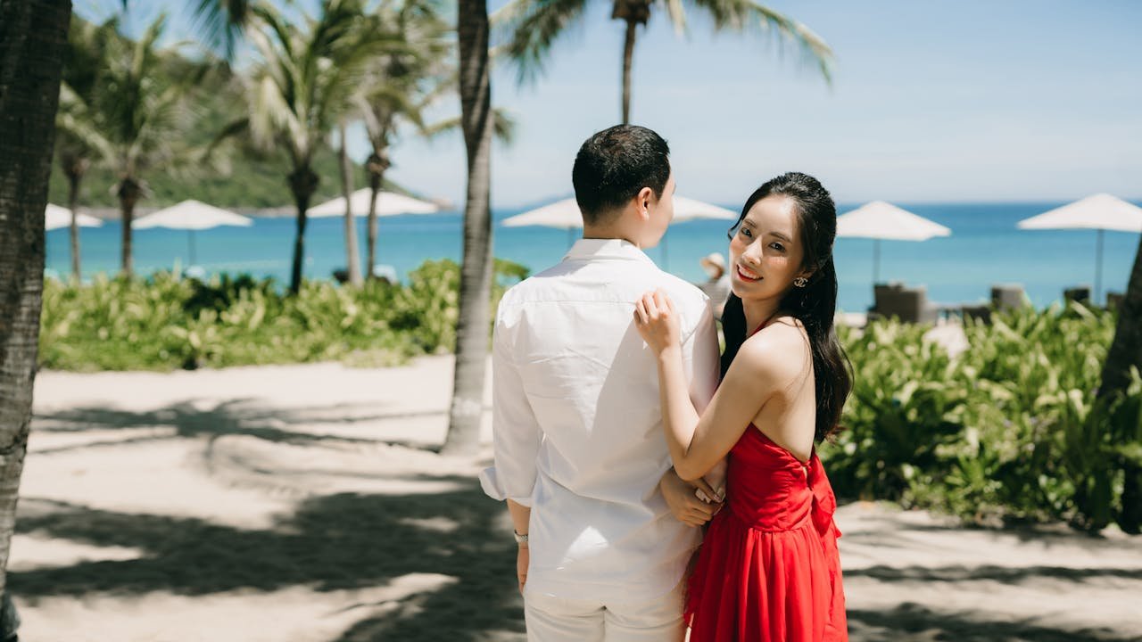 A couple walking along the beach