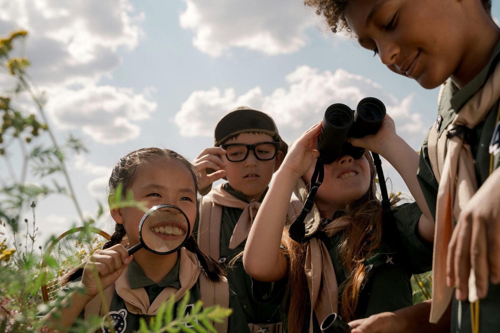 Kids watching wildlife with binoculars 