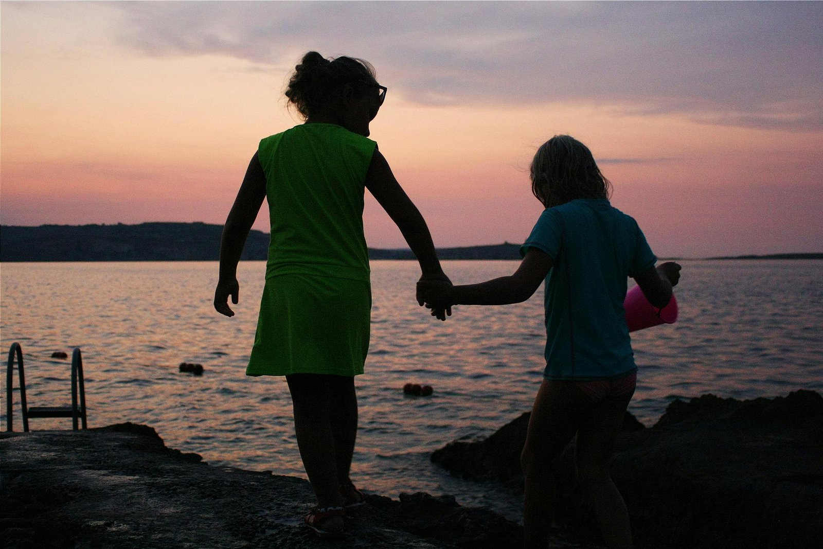 Kids walking along the beach 